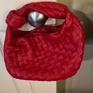 Red woven handbag